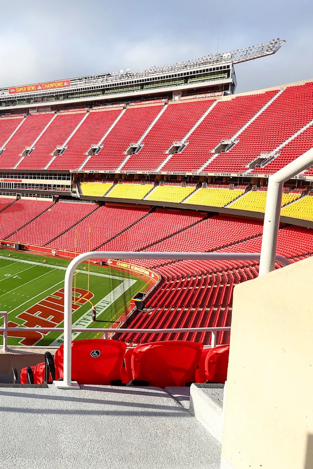 Red and gold seats overlooking the field at Arrowhead Stadium