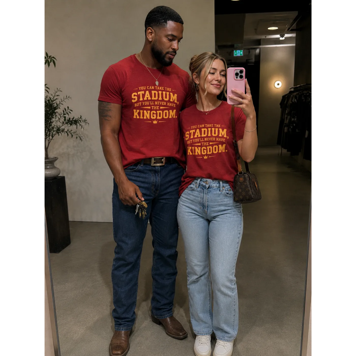 Man and woman wearing the red Kingdom Tee together
