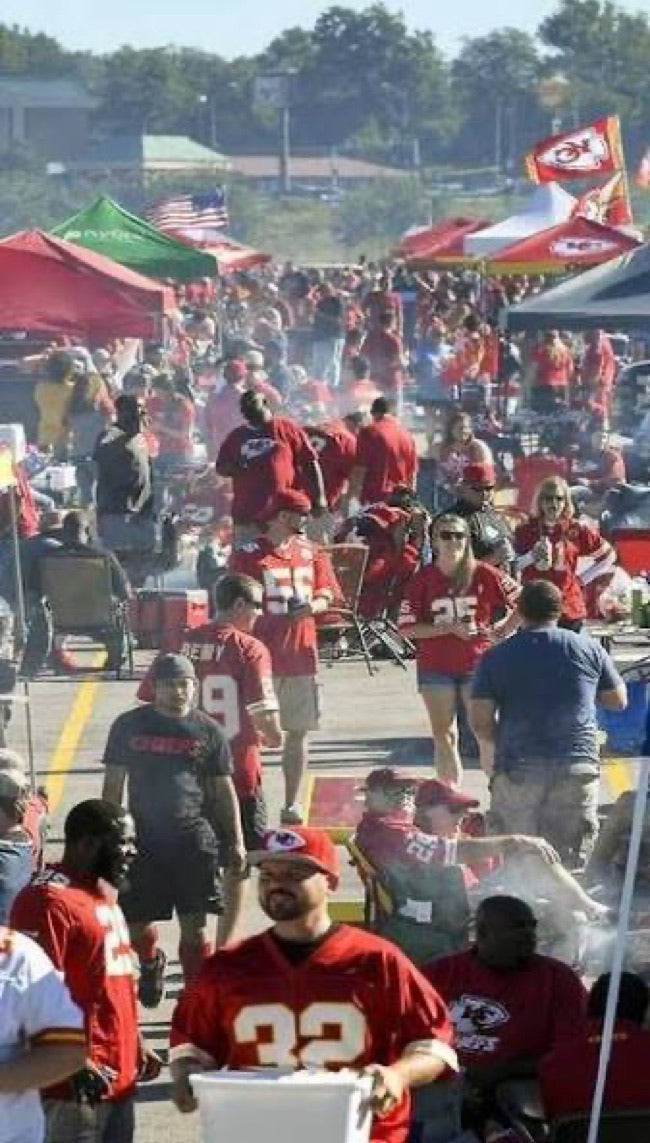 A crowded Kansas City tailgate filled with fans in red